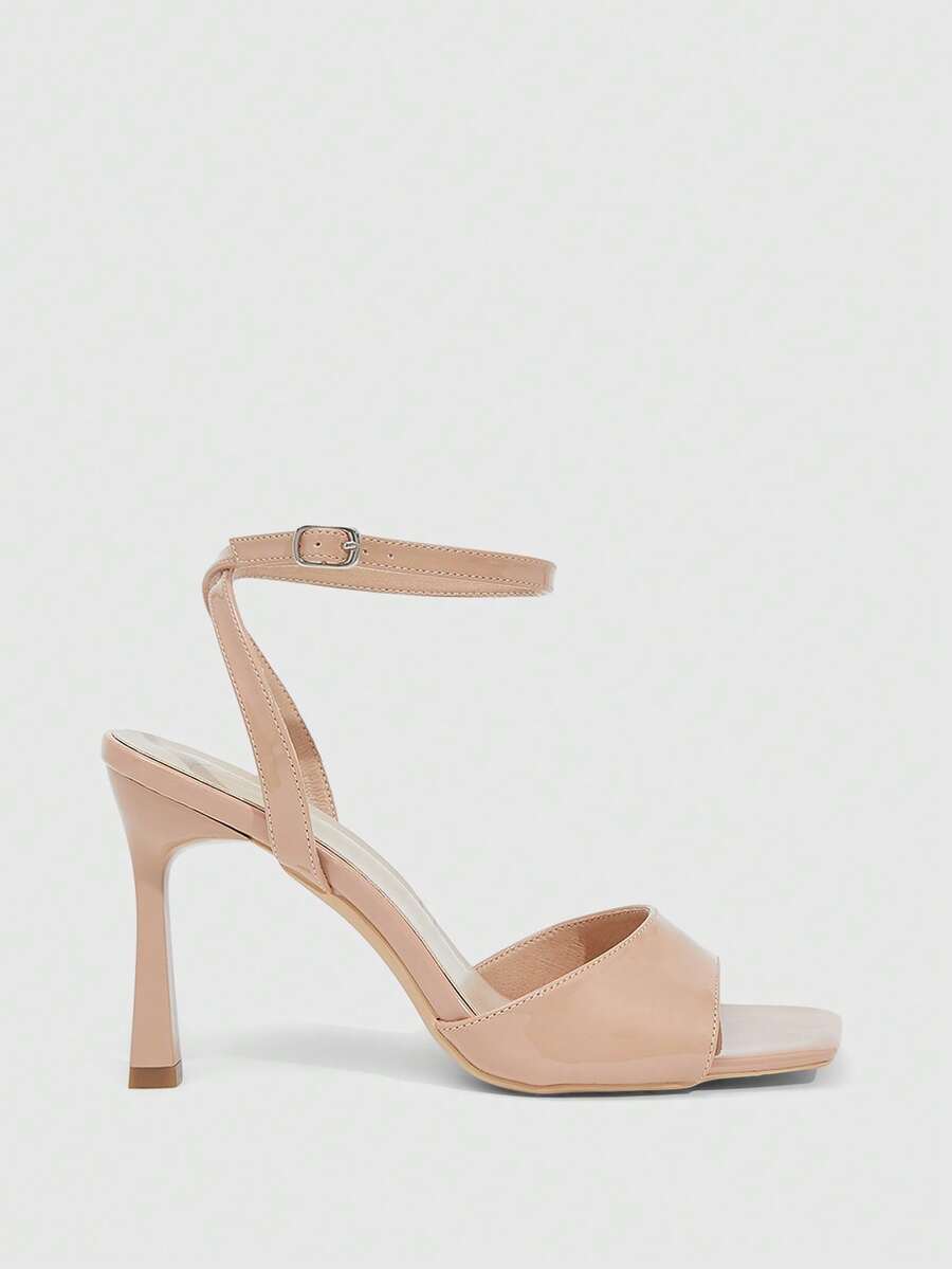 Women's peep toe ankle strap high heel sandals featuring a sleek stiletto heel and adjustable buckle closure.
