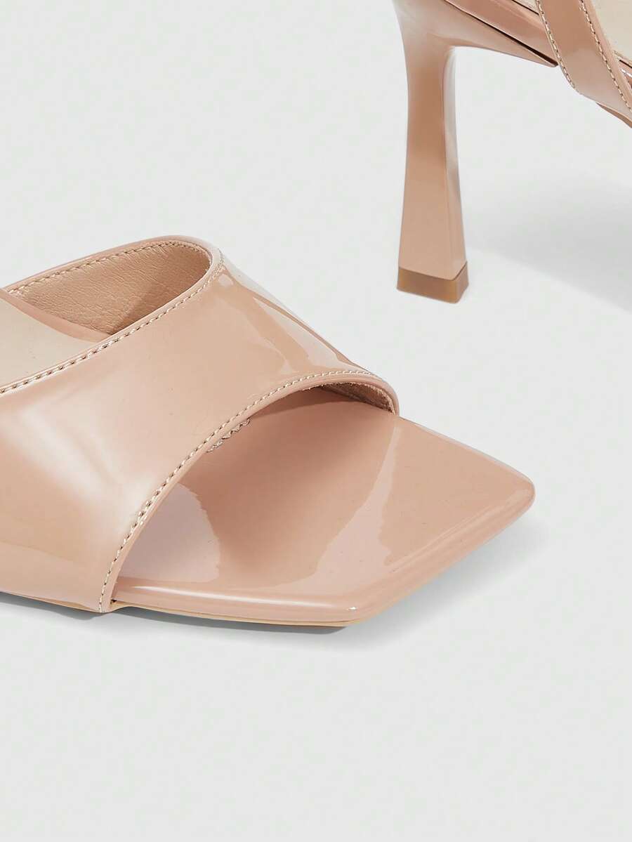 Women's peep toe ankle strap high heel sandals featuring a sleek stiletto heel and adjustable buckle closure.
