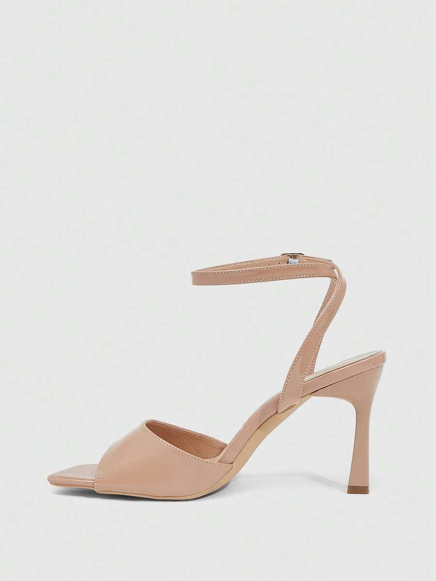 Women's peep toe ankle strap high heel sandals featuring a sleek stiletto heel and adjustable buckle closure.