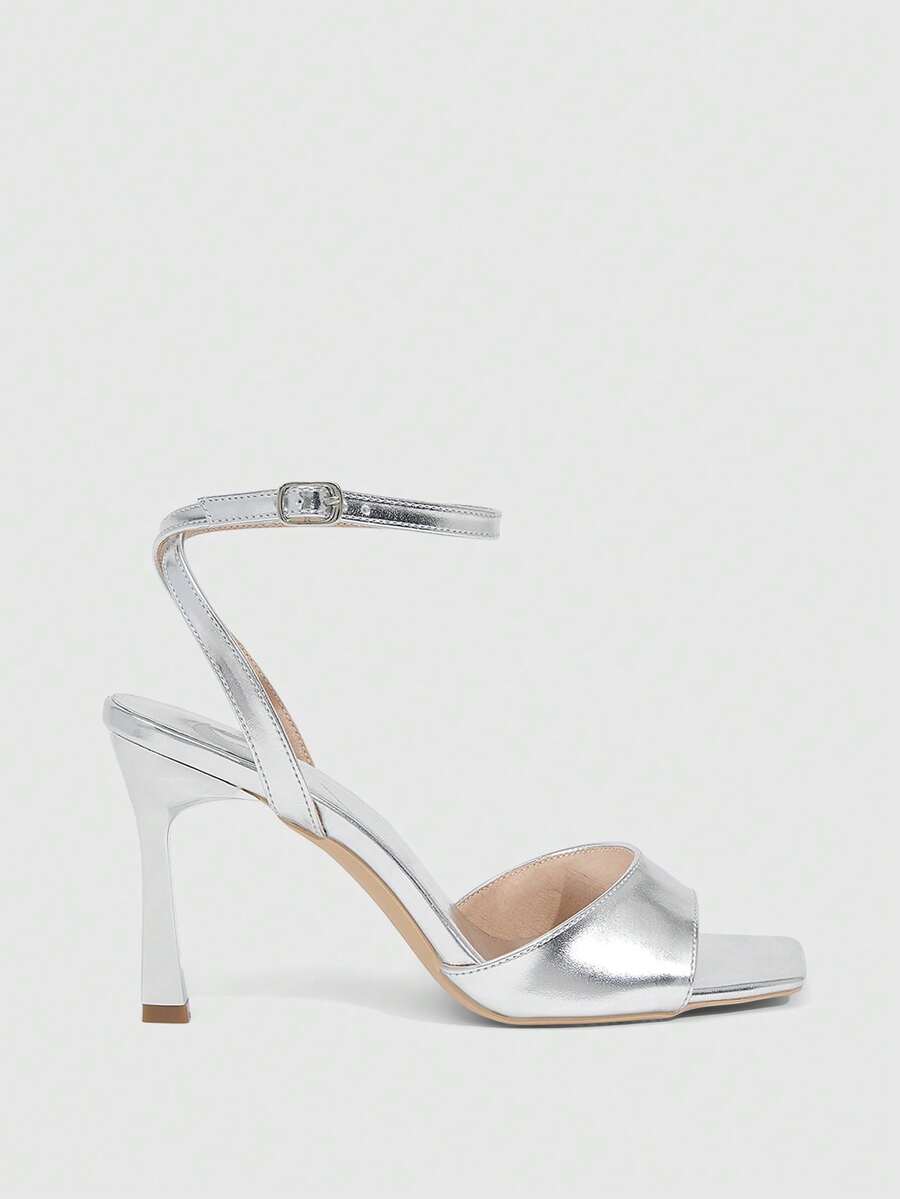 Women's peep toe ankle strap high heel sandals featuring a sleek stiletto heel and adjustable buckle closure.