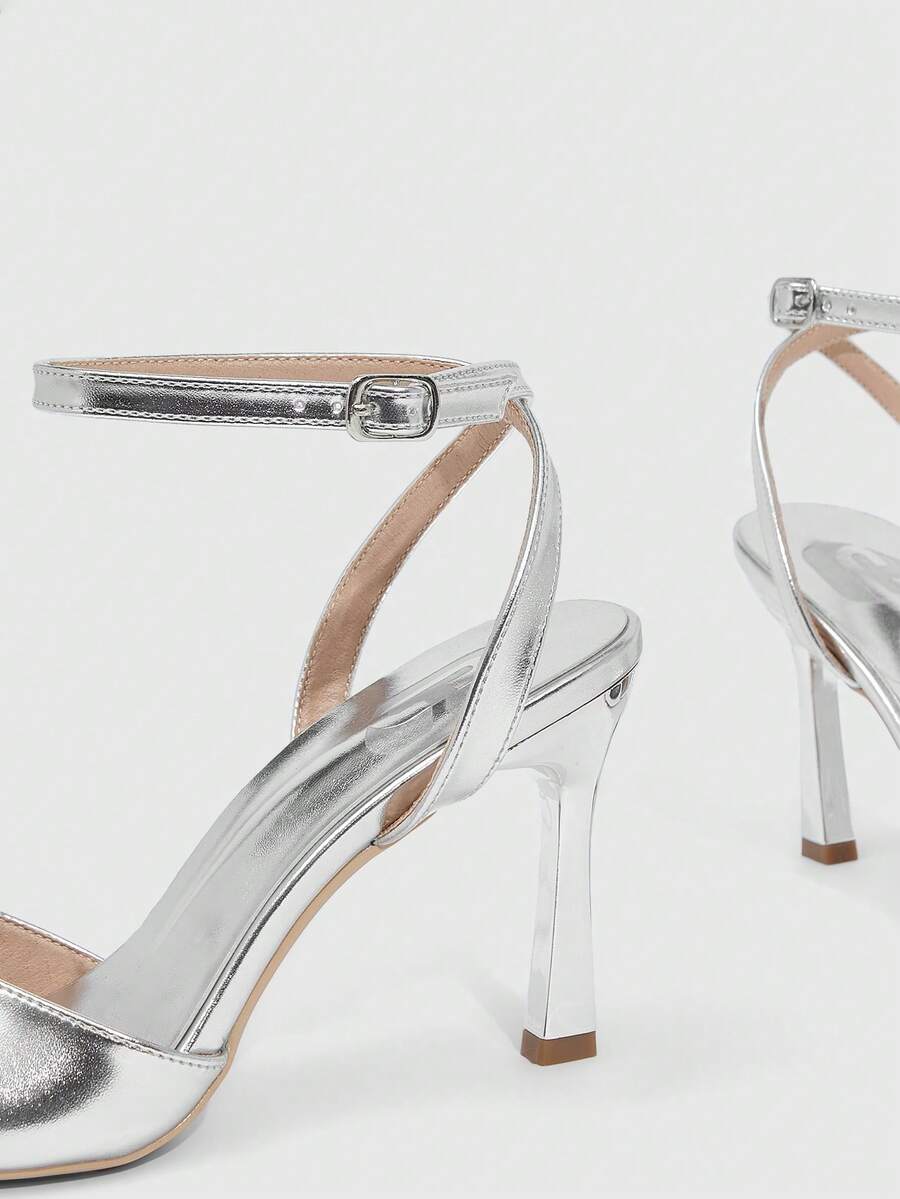 Women's peep toe ankle strap high heel sandals featuring a sleek stiletto heel and adjustable buckle closure.