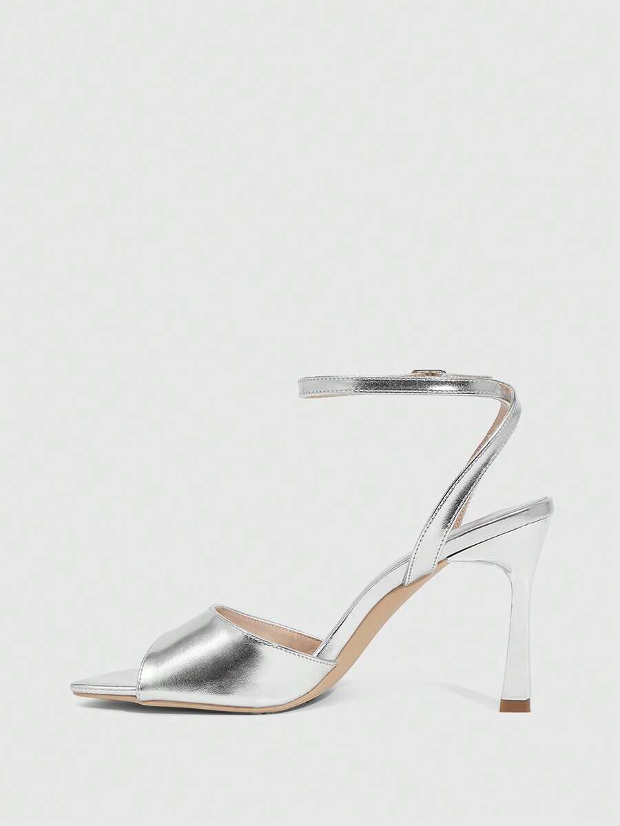 Women's peep toe ankle strap high heel sandals featuring a sleek stiletto heel and adjustable buckle closure.