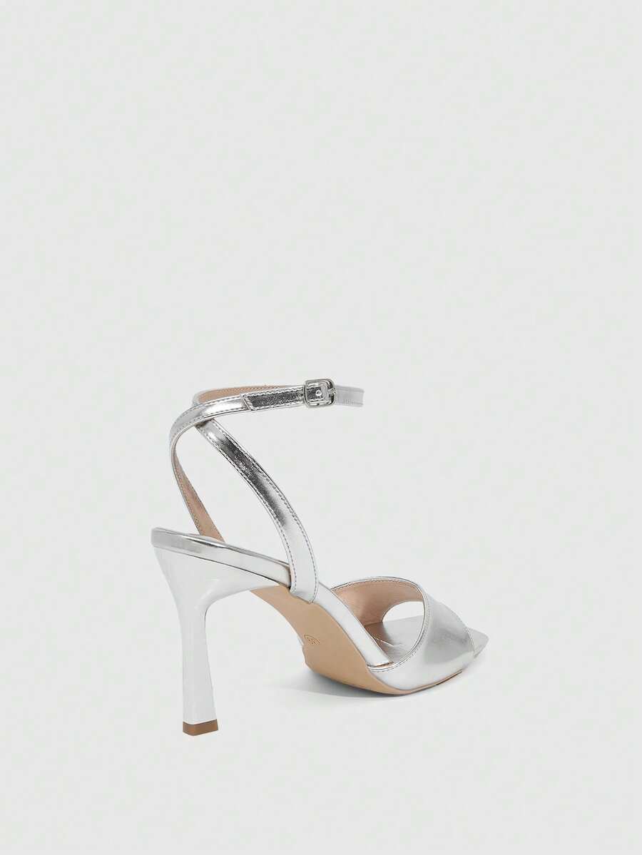 Women's peep toe ankle strap high heel sandals featuring a sleek stiletto heel and adjustable buckle closure.