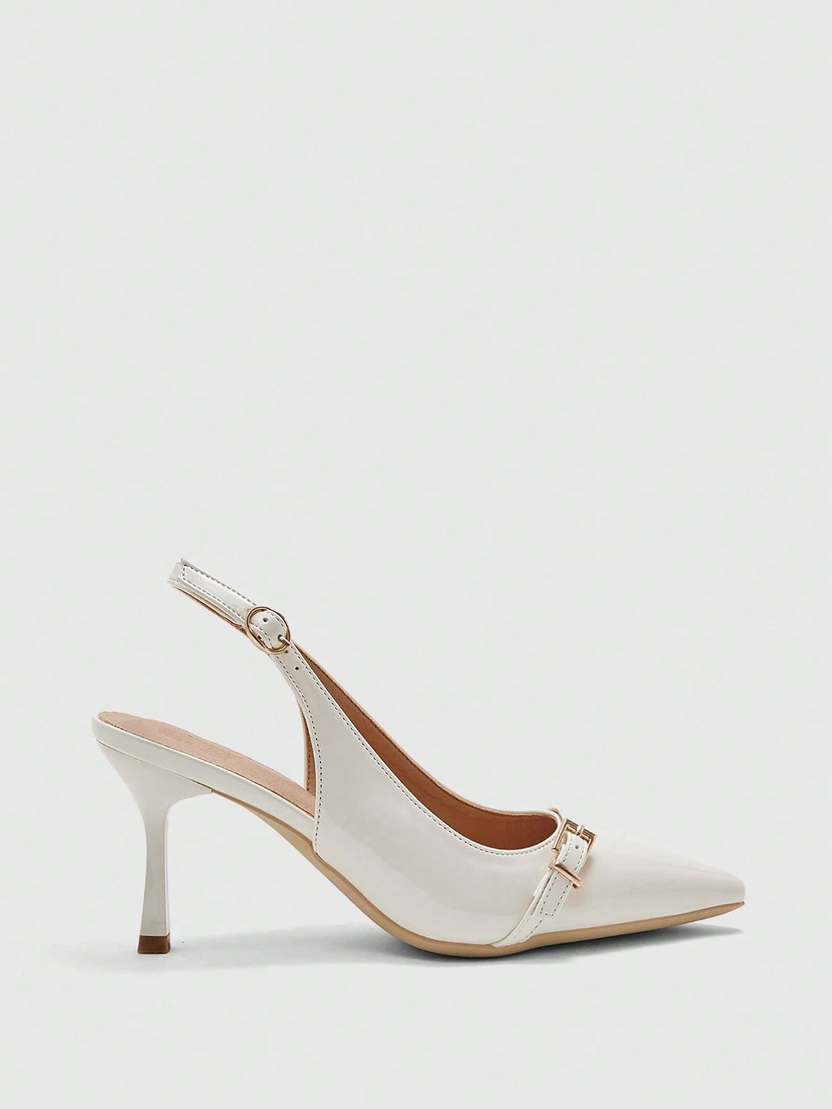Beige pointed toe high heel pumps featuring a sleek stiletto heel and slingback strap for women.
