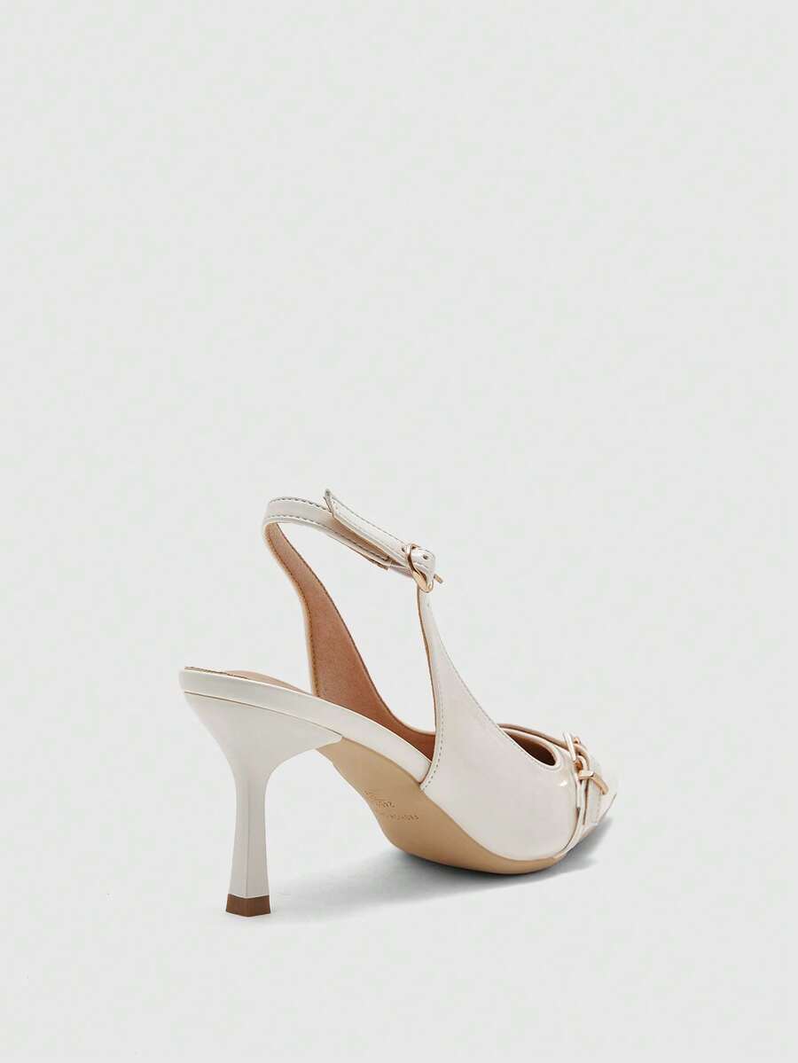 Beige pointed toe high heel pumps featuring a sleek stiletto heel and slingback strap for women.
