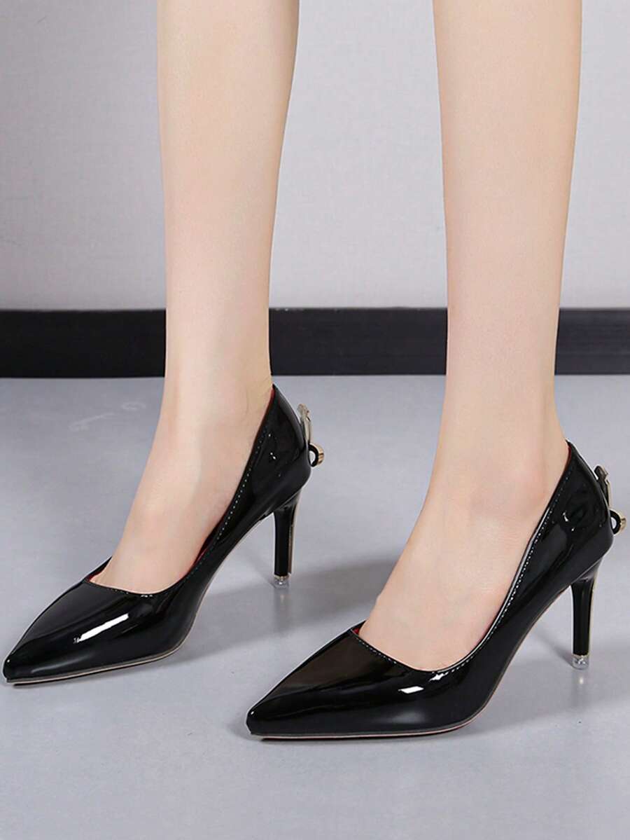 Glossy black pointed toe stiletto high heel pumps with bow detail for women