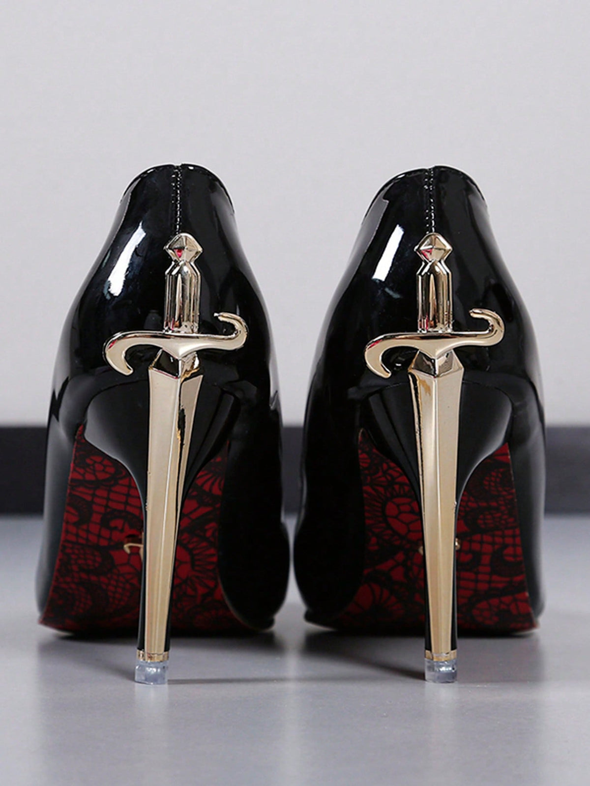 Glossy black pointed toe stiletto high heel pumps with bow detail for women