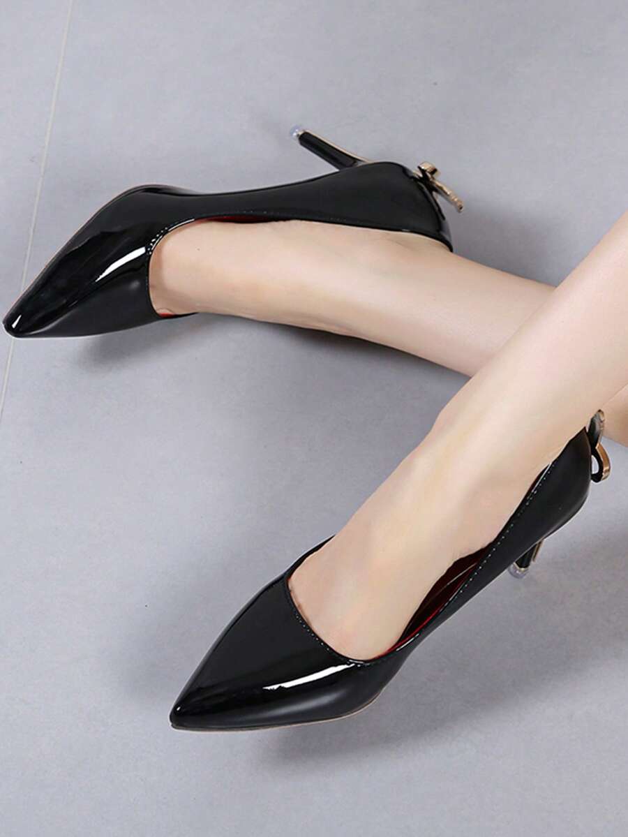Glossy black pointed toe stiletto high heel pumps with bow detail for women