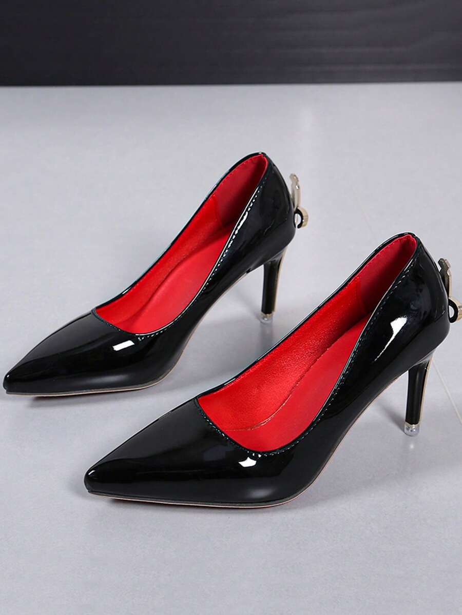 Glossy black pointed toe stiletto high heel pumps with bow detail for women