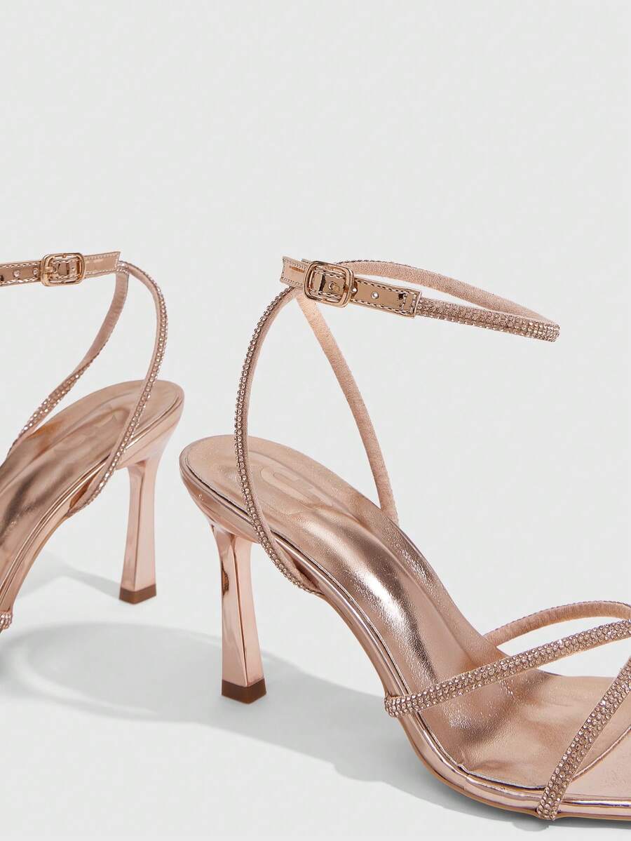 Women's open toe stiletto heel sandals featuring square toe design, criss-cross rhinestone slim straps, and secure ankle strap.