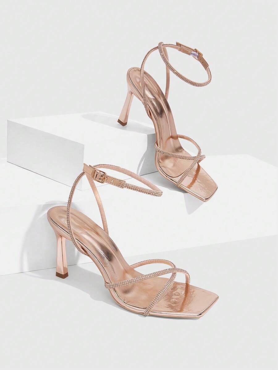 Women's open toe stiletto heel sandals featuring square toe design, criss-cross rhinestone slim straps, and secure ankle strap.