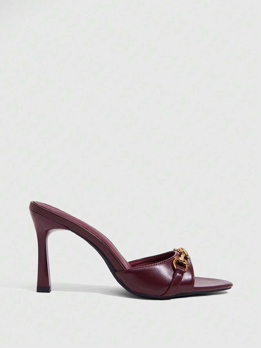 Women's open toe high heel slingback sandals featuring metal bamboo joint accent and stiletto heels.