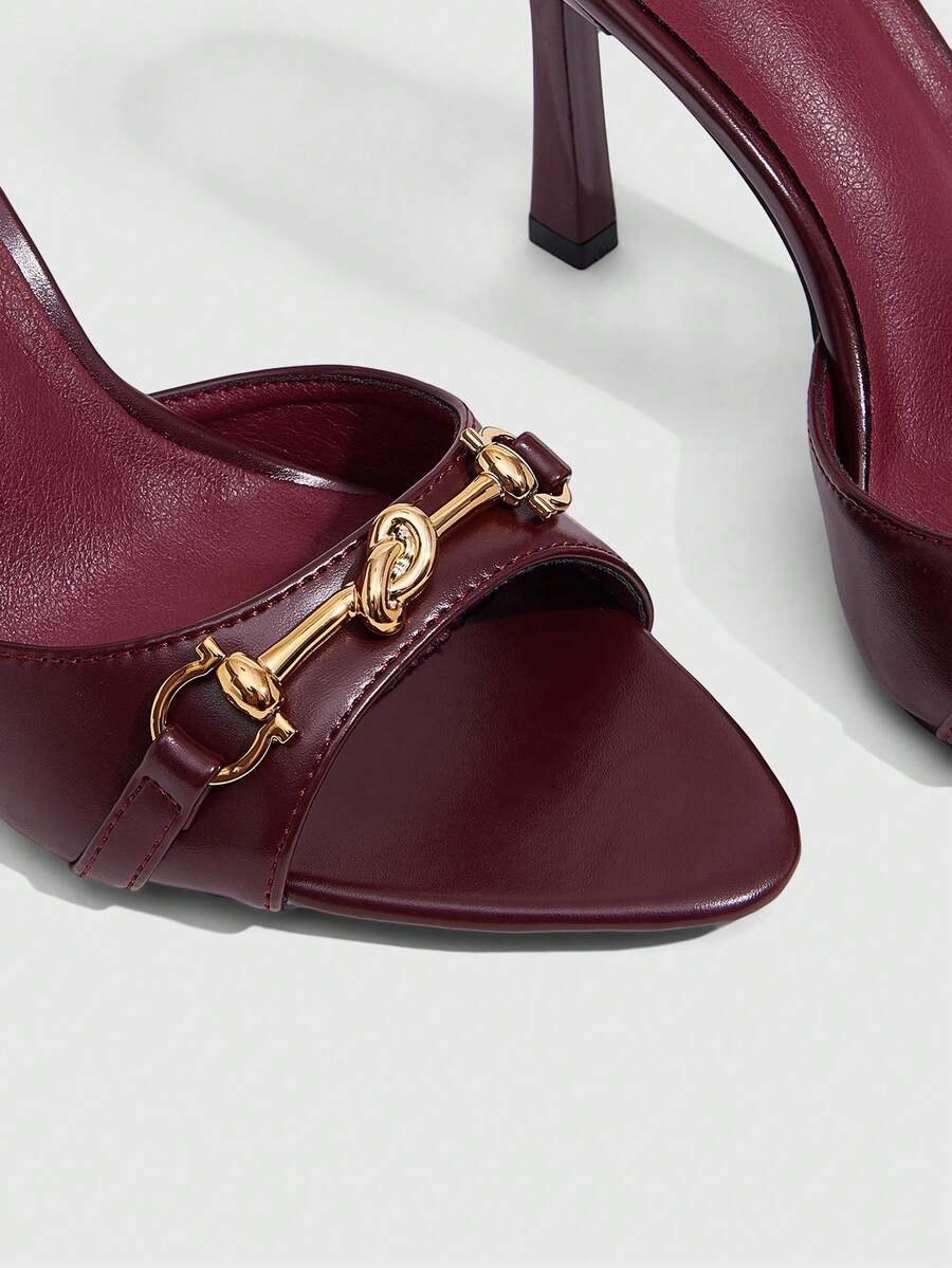 Women's open toe high heel slingback sandals featuring metal bamboo joint accent and stiletto heels.