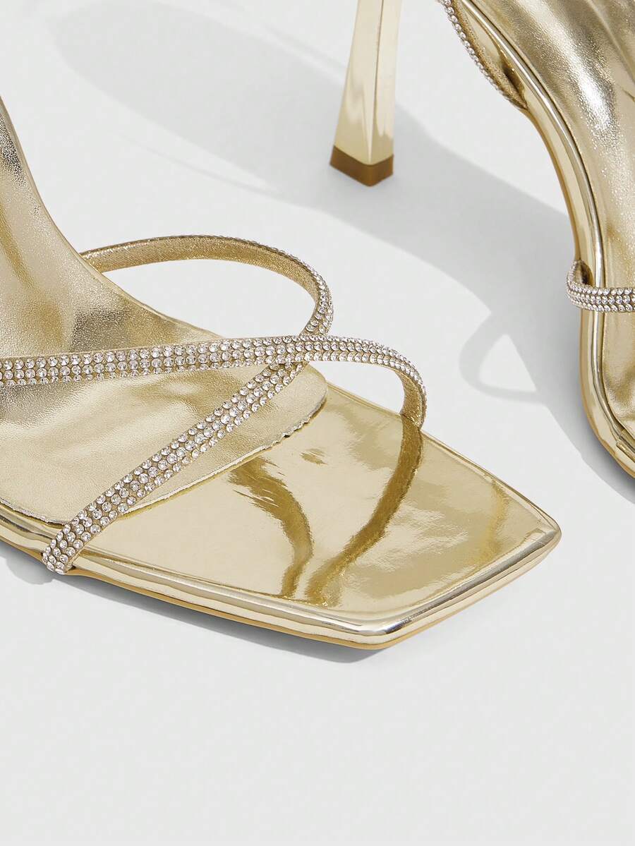 Women's open toe stiletto heel sandals featuring square toe design, criss-cross rhinestone slim straps, and secure ankle strap.