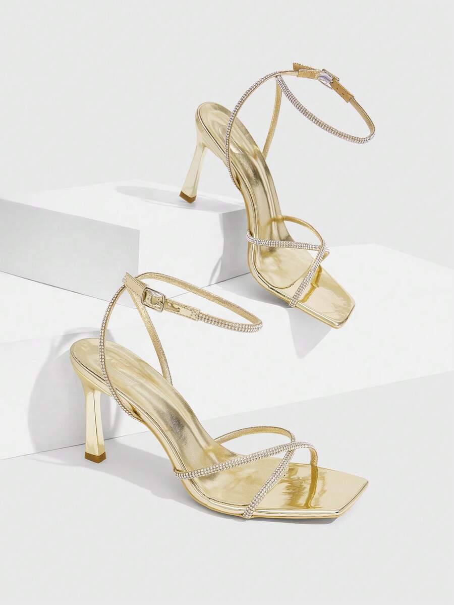 Women's open toe stiletto heel sandals featuring square toe design, criss-cross rhinestone slim straps, and secure ankle strap.