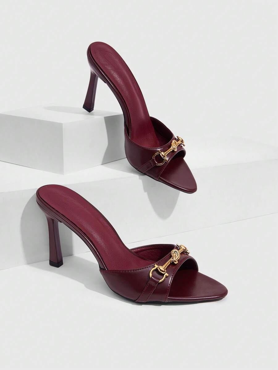 Women's open toe high heel slingback sandals featuring metal bamboo joint accent and stiletto heels.