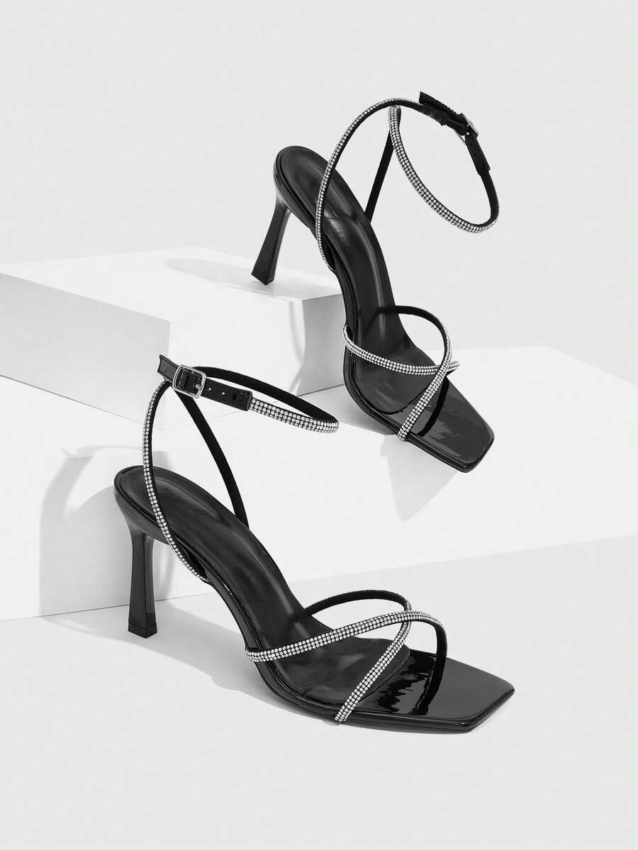 Women's open toe stiletto heel sandals featuring square toe design, criss-cross rhinestone slim straps, and secure ankle strap.