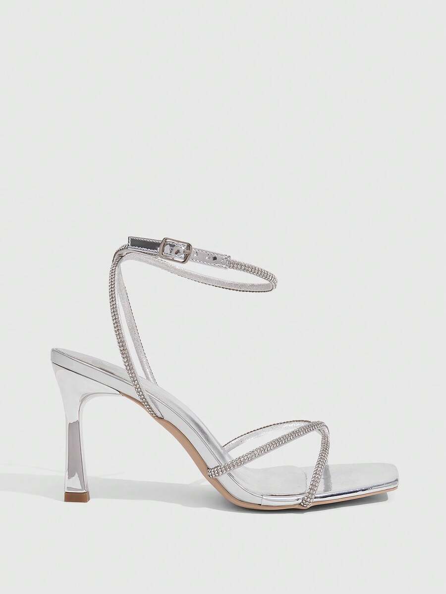 Women's open toe stiletto heel sandals featuring square toe design, criss-cross rhinestone slim straps, and secure ankle strap.