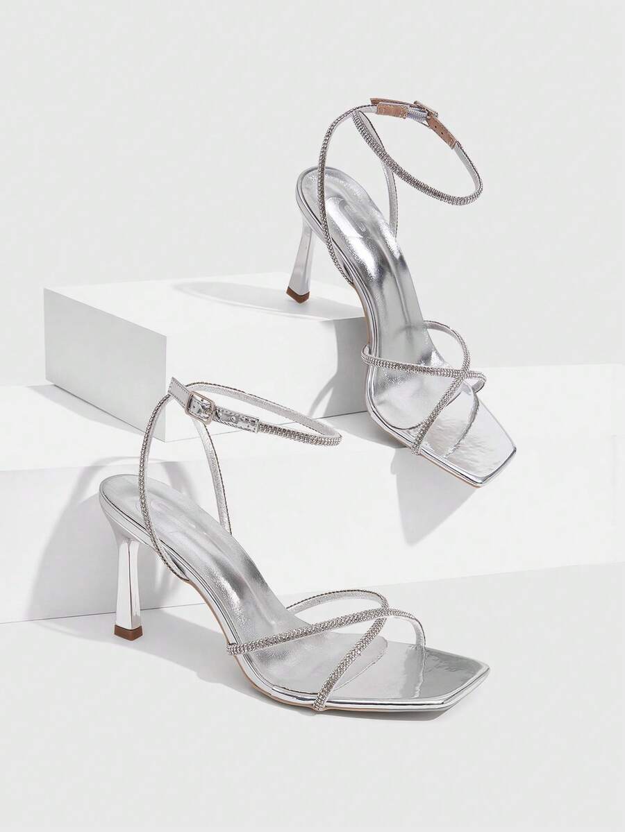 Women's open toe stiletto heel sandals featuring square toe design, criss-cross rhinestone slim straps, and secure ankle strap.