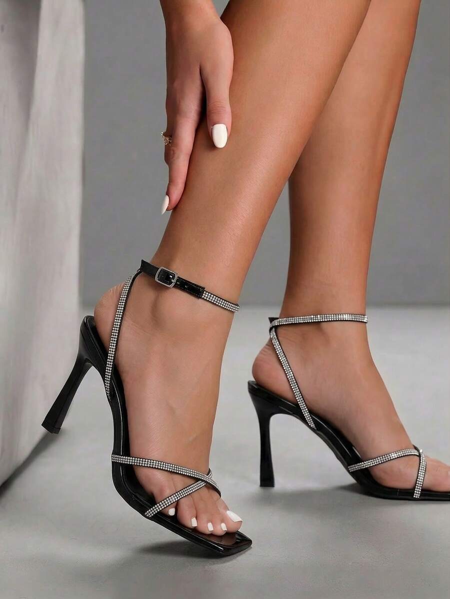 Women's open toe stiletto heel sandals featuring square toe design, criss-cross rhinestone slim straps, and secure ankle strap.