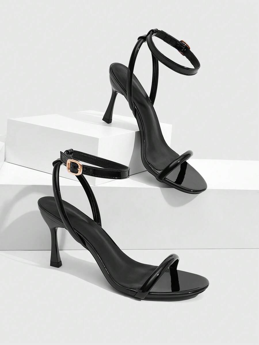 Women's open toe stiletto high heel sandals with an adjustable buckle strap and sleek PU leather finish