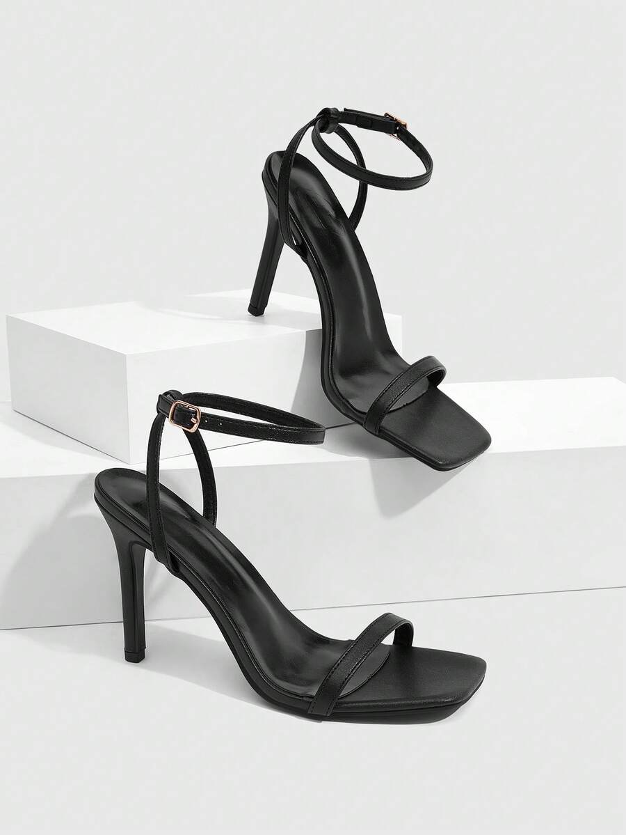 Elegant women's open toe strappy heeled sandals with stiletto high heel and ankle strap buckle closure.