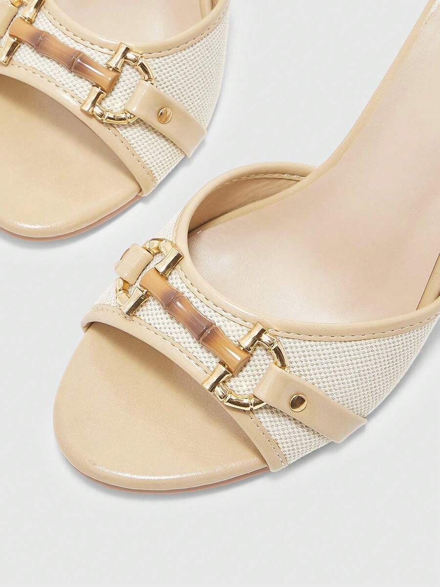 Women's open toe high heel slingback sandals featuring metal bamboo joint accent and stiletto heels.