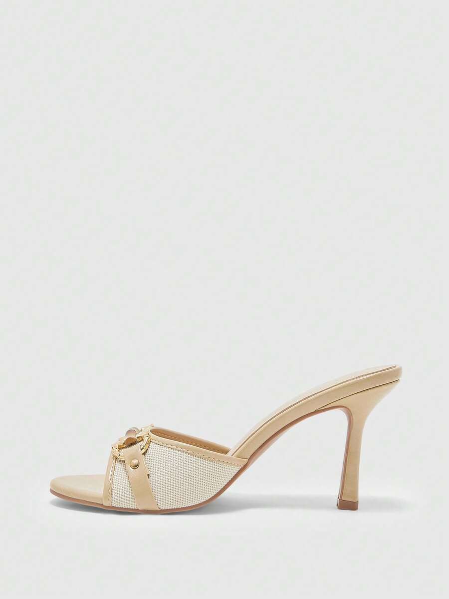 Women's open toe high heel slingback sandals featuring metal bamboo joint accent and stiletto heels.