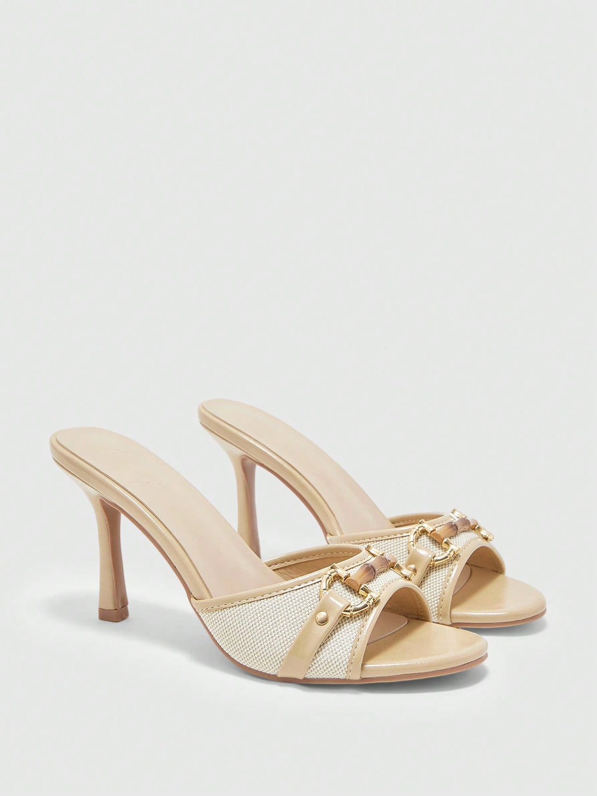 Women's open toe high heel slingback sandals featuring metal bamboo joint accent and stiletto heels.