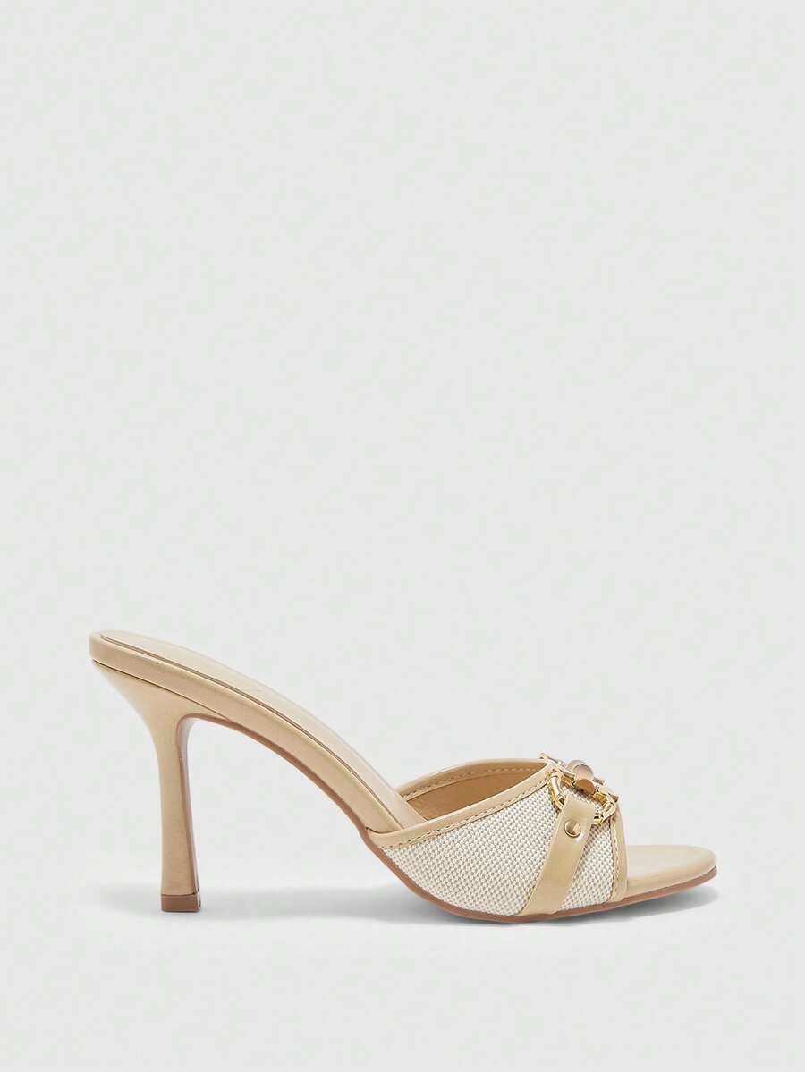 Women's open toe high heel slingback sandals featuring metal bamboo joint accent and stiletto heels.