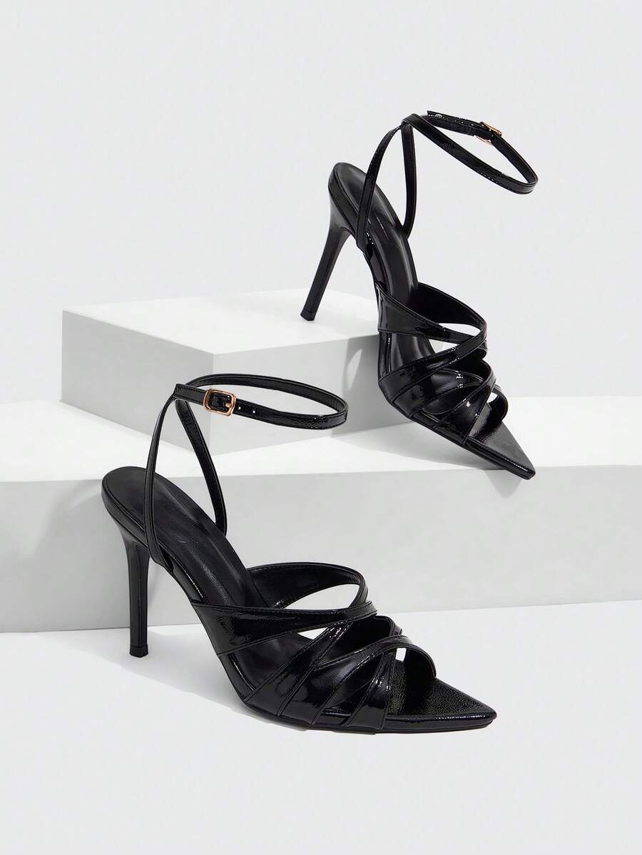 Women's open toe high stiletto sandals with cut-out cross straps and adjustable ankle buckle closure.