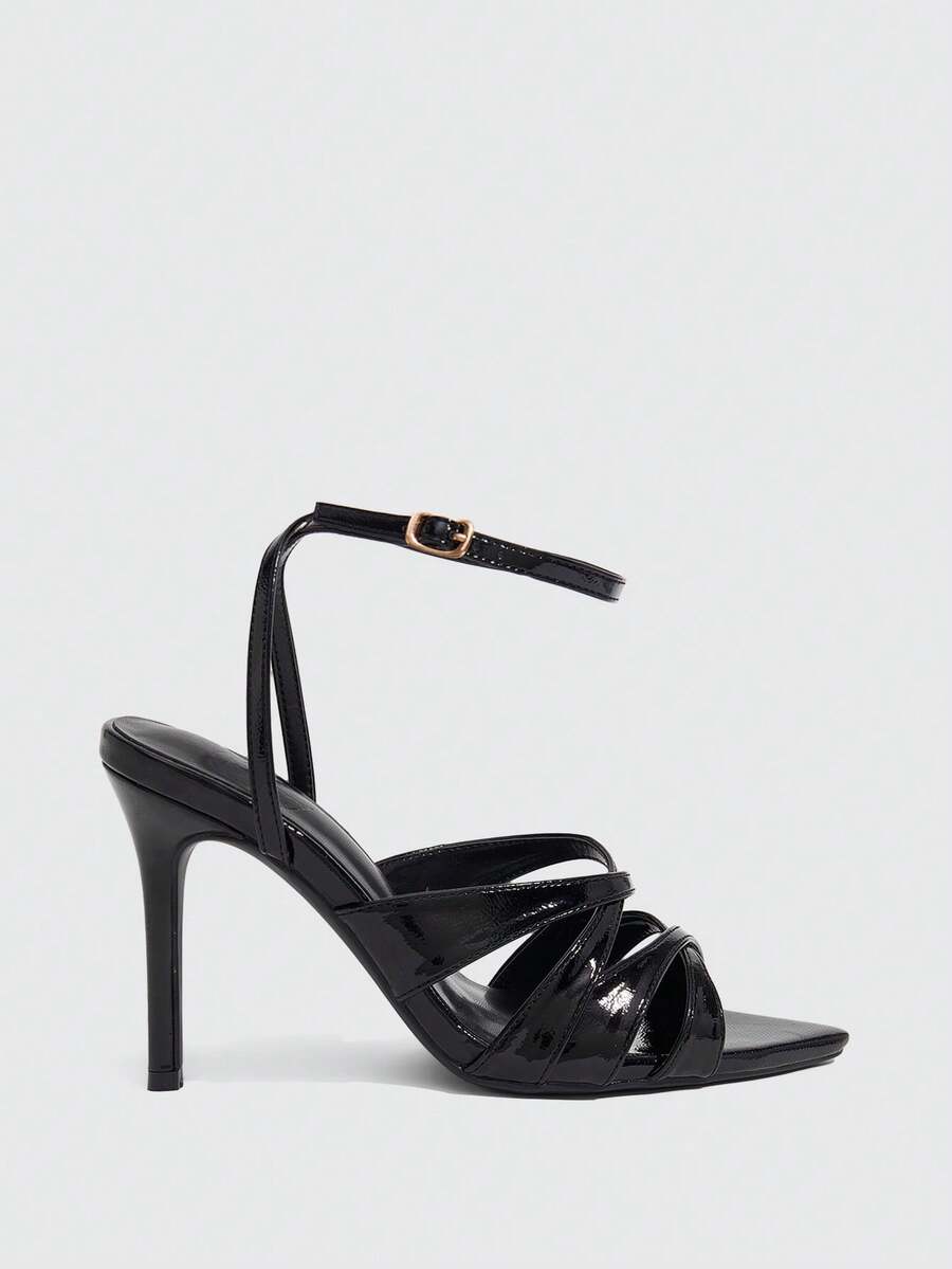 Women's open toe high stiletto sandals with cut-out cross straps and adjustable ankle buckle closure.
