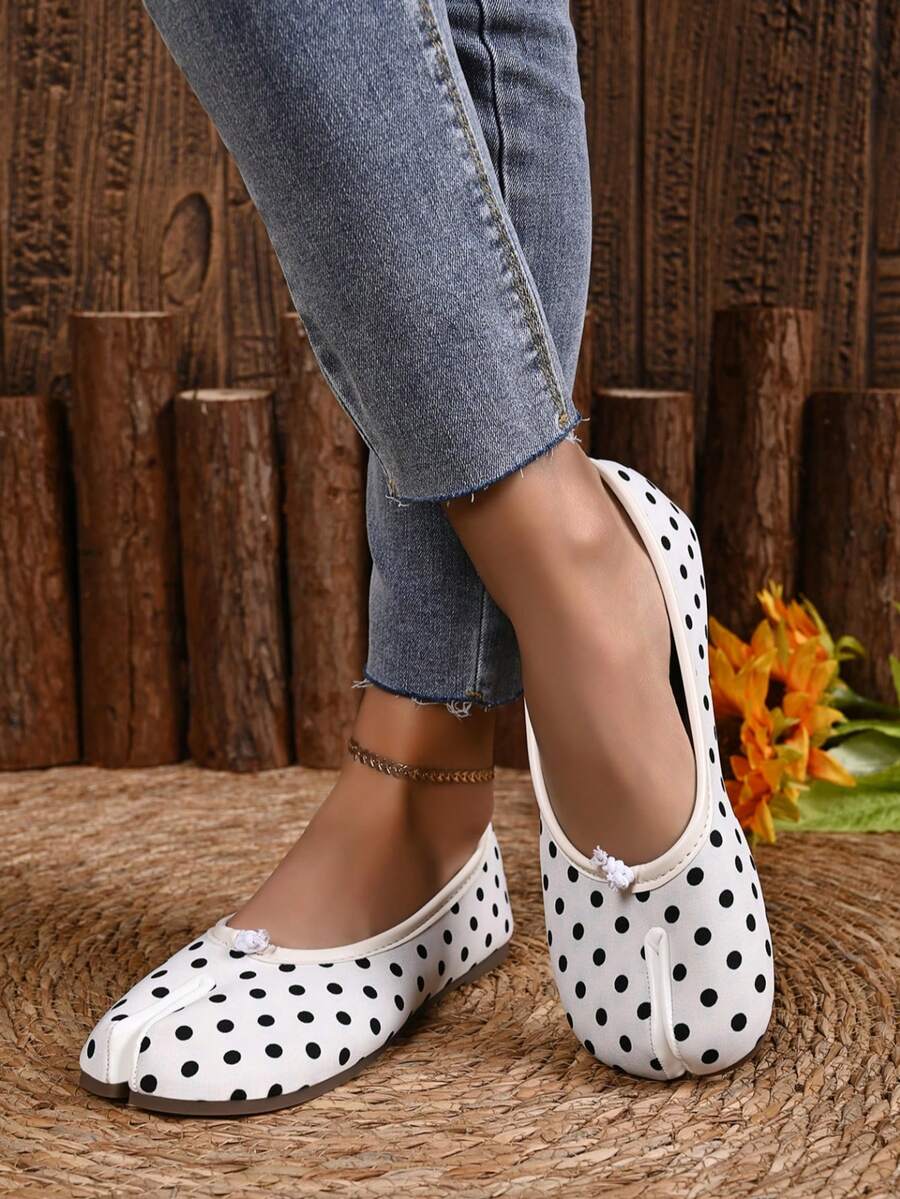 Women's white split-toe slip-on flat shoes with braided accent and rubber sole
