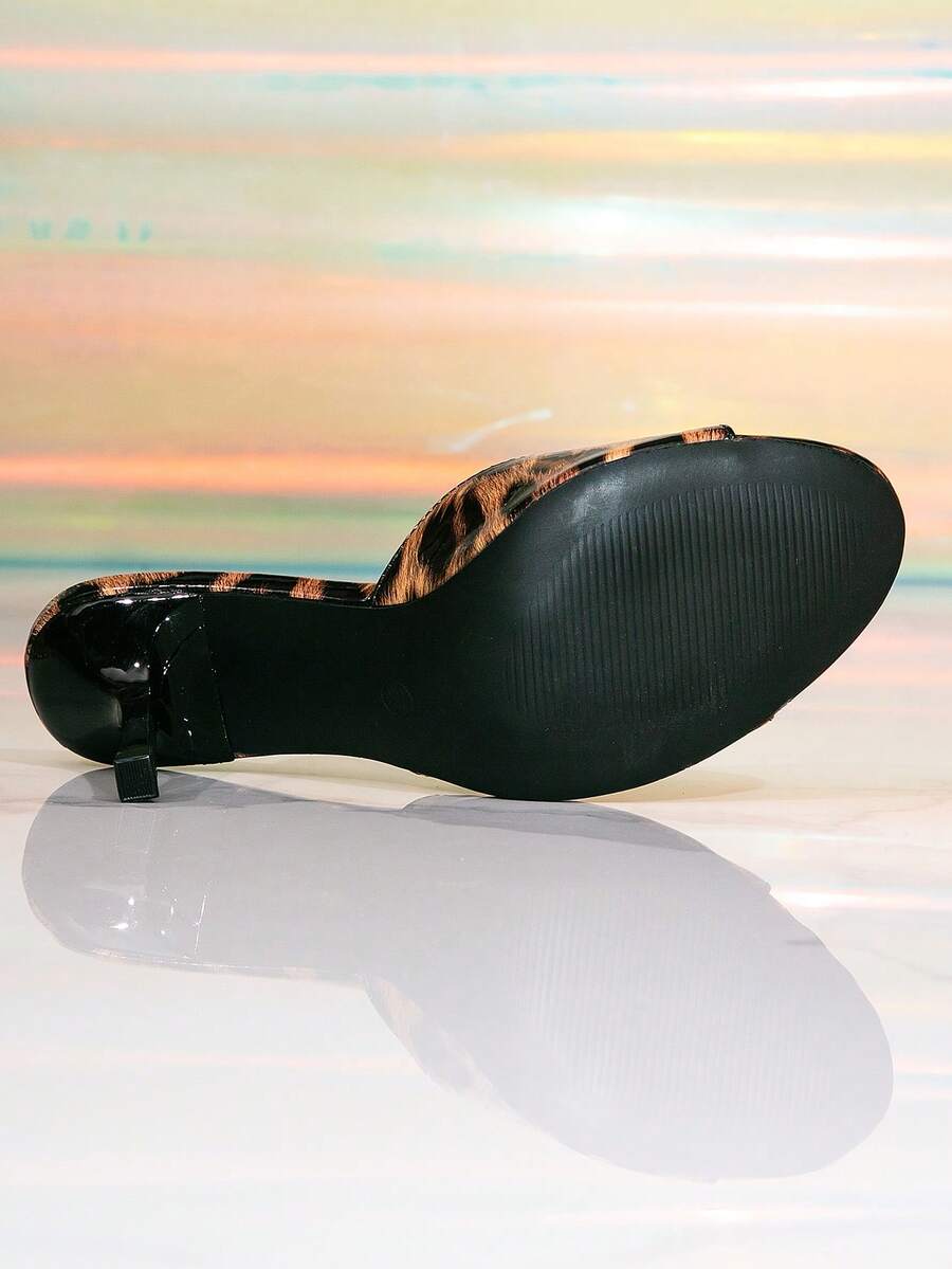 Elegant women's black stiletto heel sandals with open toe slingback design and PU leather upper.