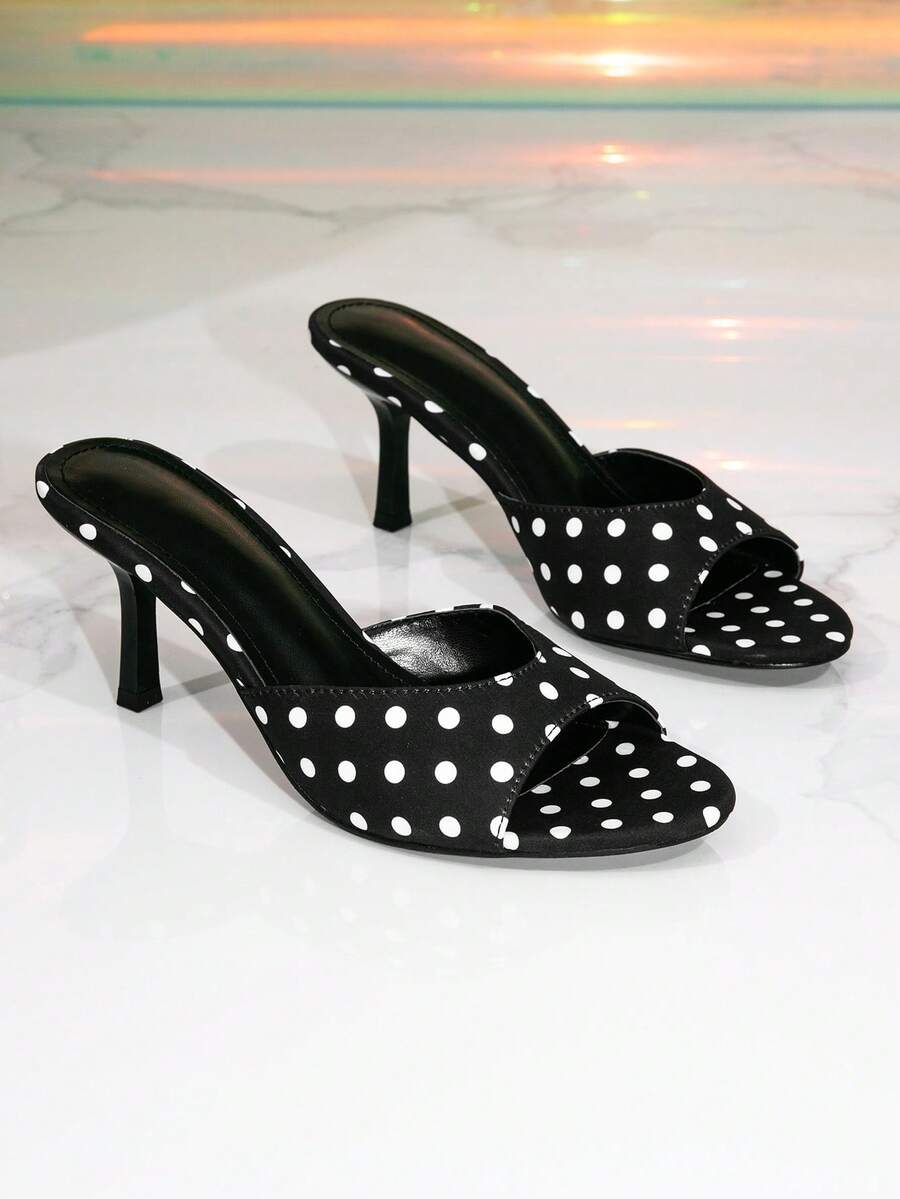 Elegant women's black stiletto heel sandals with open toe slingback design and PU leather upper.