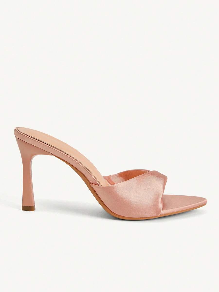 Women's peep toe high-heeled stiletto sandals with slingback strap in light metallic finish.