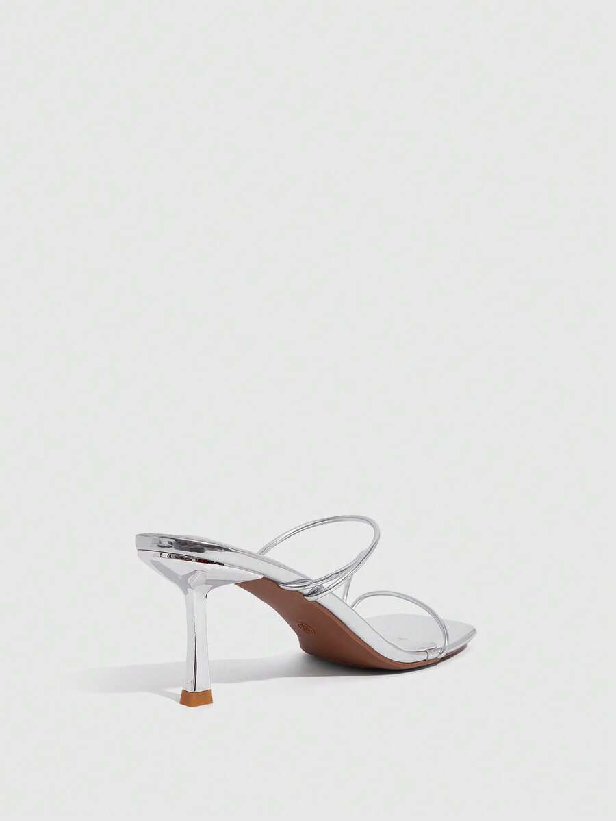 Women's open toe stiletto heel sandals featuring square toe design, criss-cross rhinestone slim straps, and secure ankle strap.