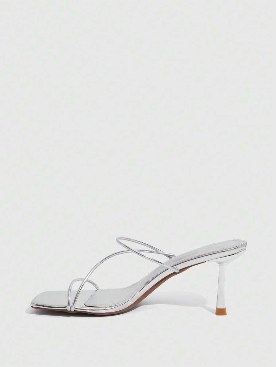 Women's open toe stiletto heel sandals featuring square toe design, criss-cross rhinestone slim straps, and secure ankle strap.
