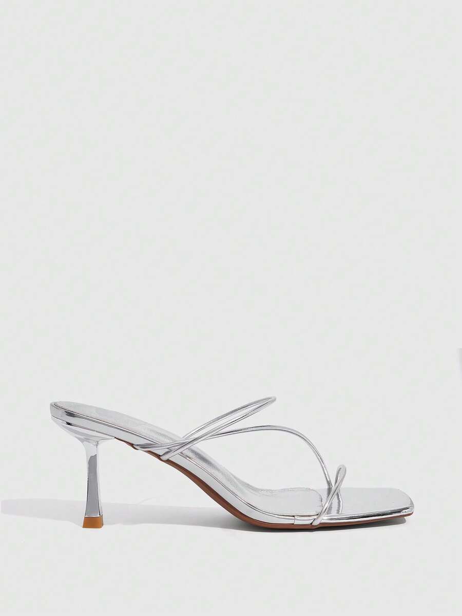 Women's open toe stiletto heel sandals featuring square toe design, criss-cross rhinestone slim straps, and secure ankle strap.