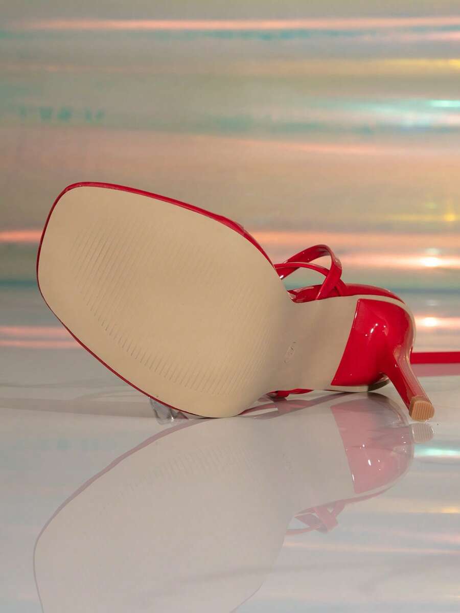 Women's stiletto high heel thong sandals featuring a T-strap toe loop design and ankle buckle strap