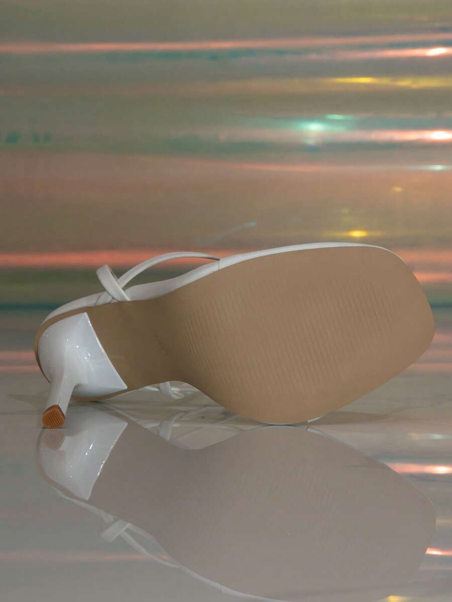 Women's stiletto high heel thong sandals featuring a T-strap toe loop design and ankle buckle strap
