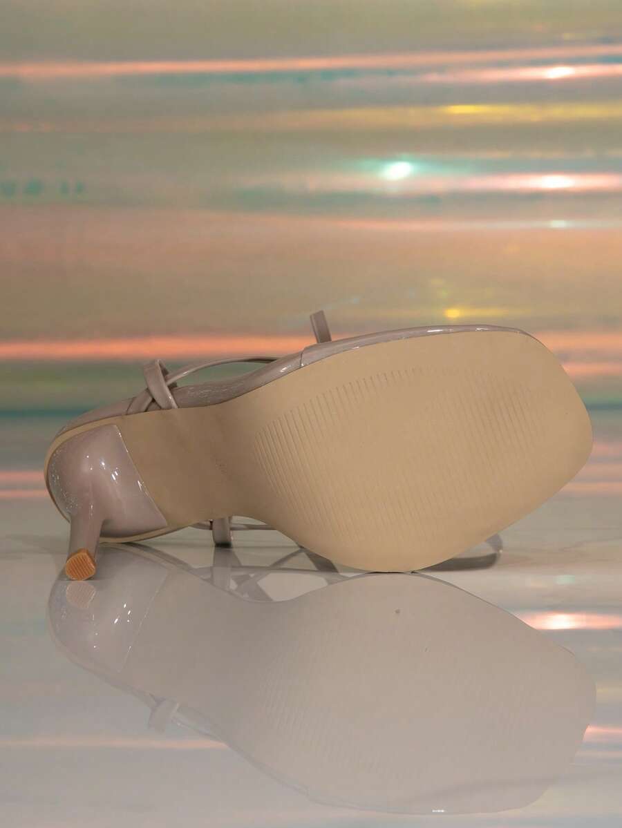 Women's stiletto high heel thong sandals featuring a T-strap toe loop design and ankle buckle strap