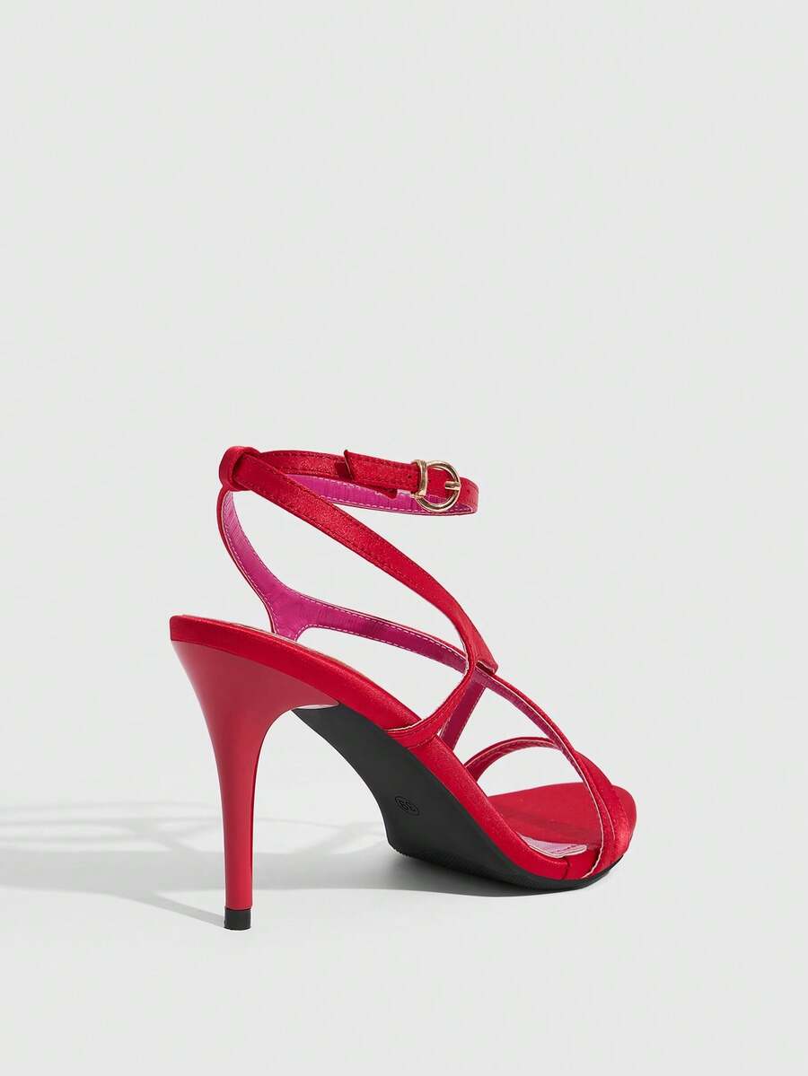Square toe stiletto high heel sandals in deep burgundy satin featuring criss cross straps and an open toe design.
