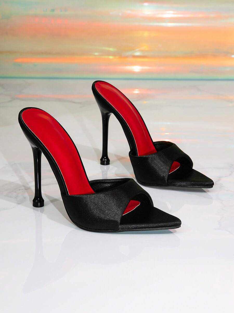 Women's pointed toe high heel mule sandals featuring stiletto heels and decorative accents for party wear.