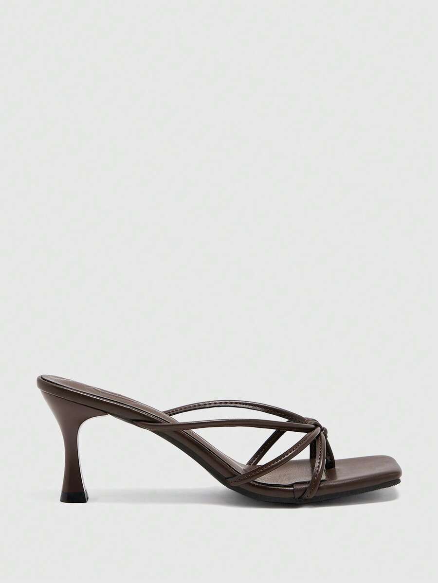 Square toe stiletto heel thong sandals for women featuring thin toe post strap, knot detail, and mid pyramid heel.