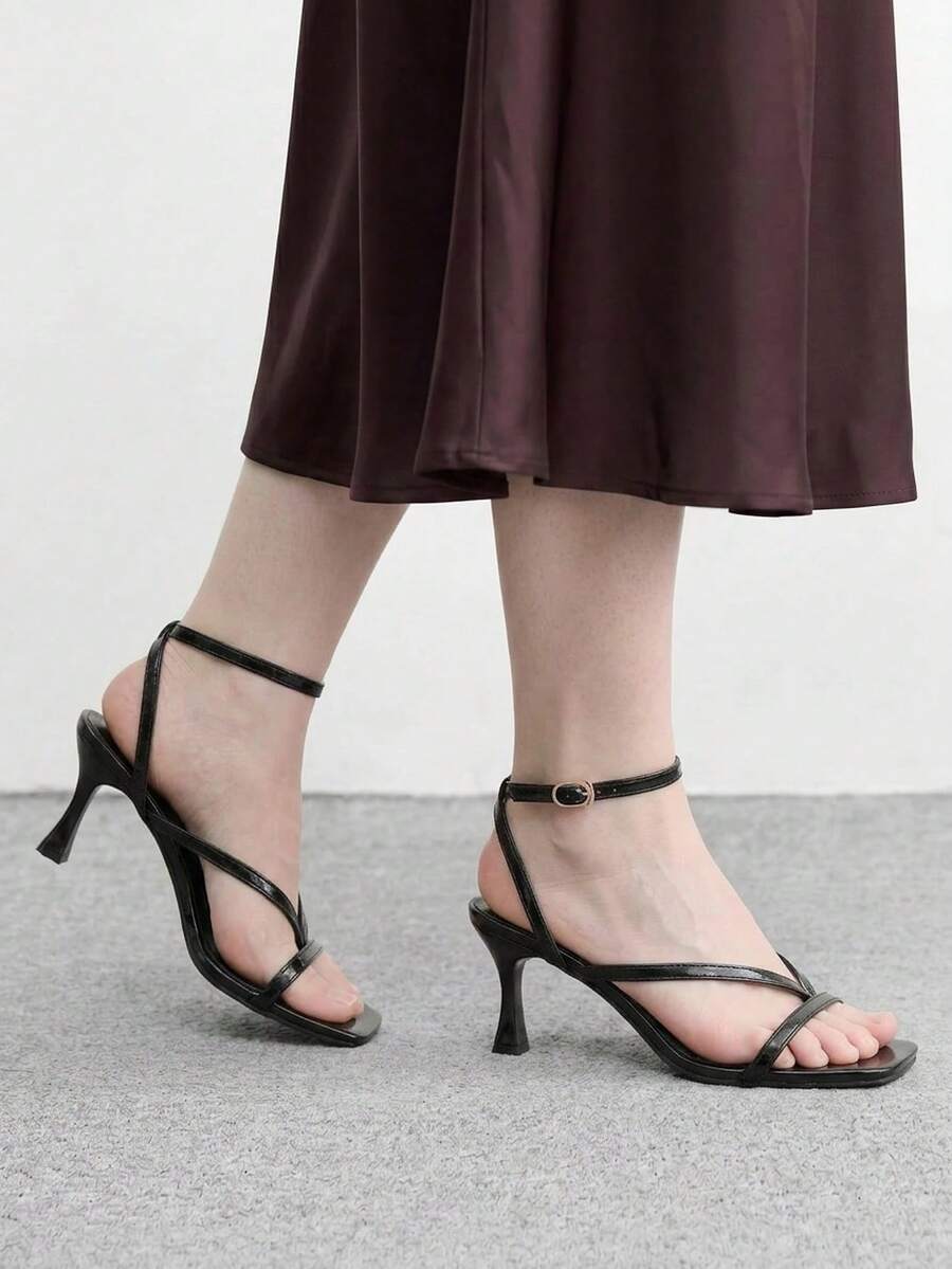 Burgundy women's thin strap thong sandals with ankle strap and kitten heels.
