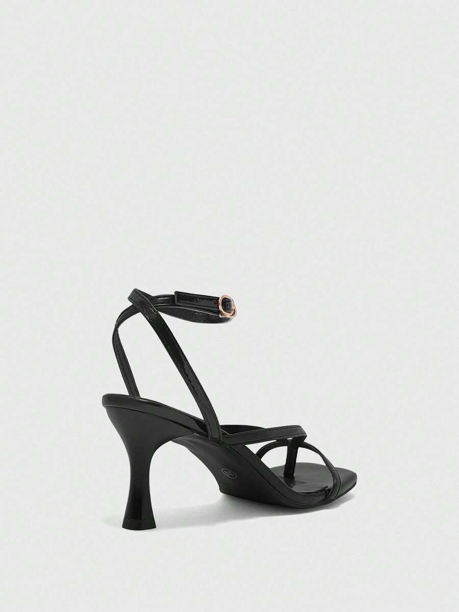 Burgundy women's thin strap thong sandals with ankle strap and kitten heels.