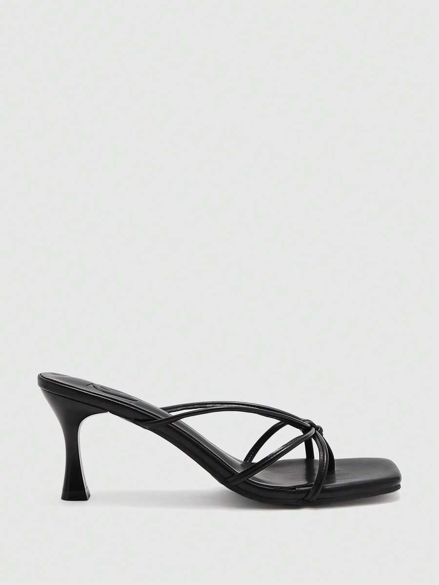 Square toe stiletto heel thong sandals for women featuring thin toe post strap, knot detail, and mid pyramid heel.