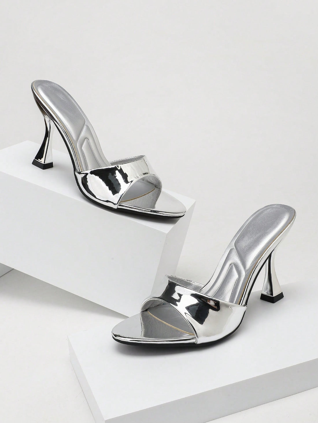 Women's stiletto high heel sandals with an open round toe and slingback strap crafted from smooth PU leather.