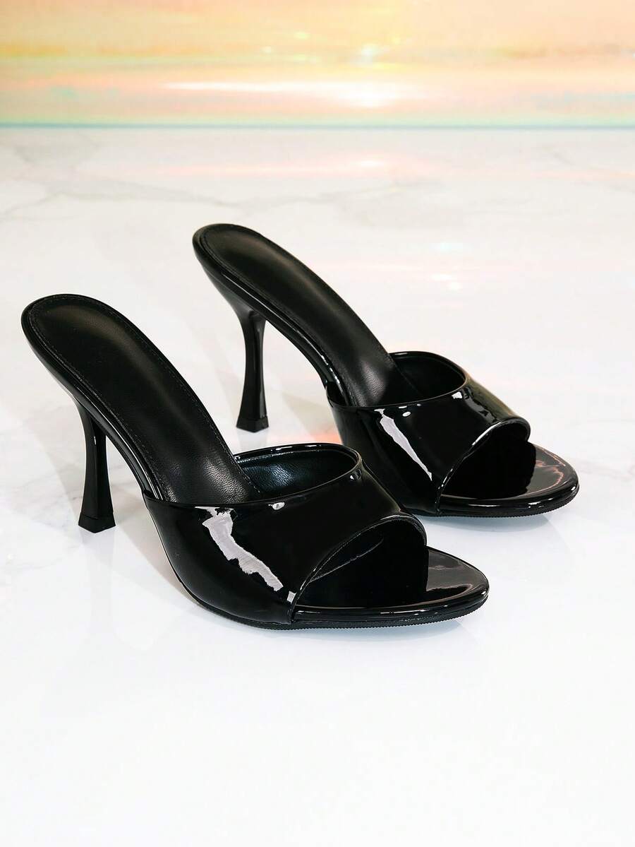 Black patent PU slip-on stiletto high heel sandals featuring a round toe mule silhouette.